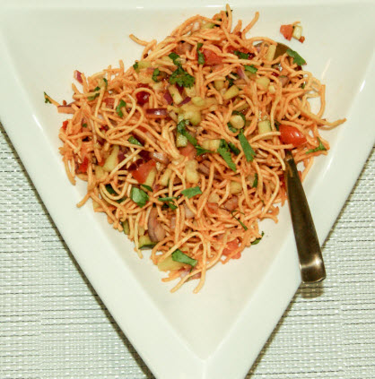 Chinese Bhel is an Indo-Chinese fusion spicy snack. It is super quick to prepare. You can serve Chinese Bhel as an appetizer or evening light snacks along with Coffee or Tea.