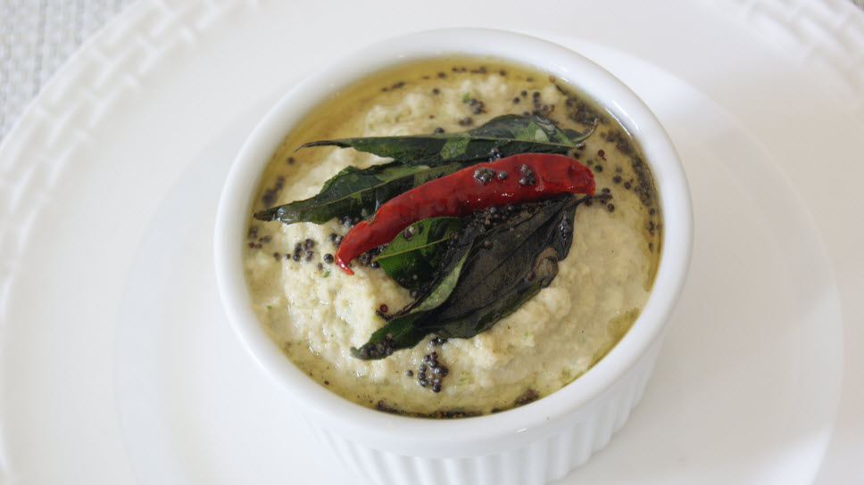 Coconut Chutney is a famous chutney originating from the Southern part of India. It is served with Dosa, Idly, Vada or Uttapam.